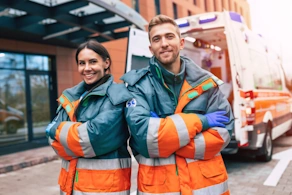 Life Assure Paramedics Standing Near Ambulance Blog